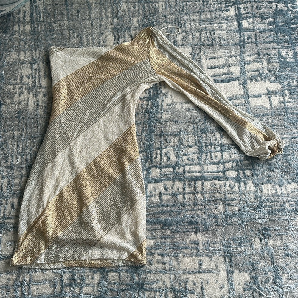 gold, silver, and white one shoulder long sleeve homecoming/party dress